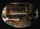 Weaving Loom * One man sitting on the floor spinning thread, while another sits behind at the loom, weaving the fabric. * 576 x 415 * (78KB)